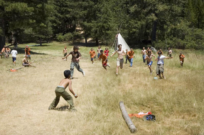 Scouts in a pick-up game of Soccer in the meadow between Waterfront and Scoutcraft.