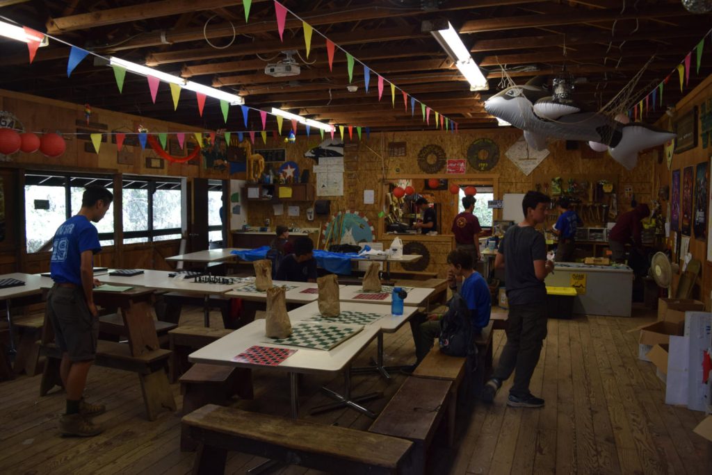 Handicraft awaiting the start of the Chess Merit Badge tournament.