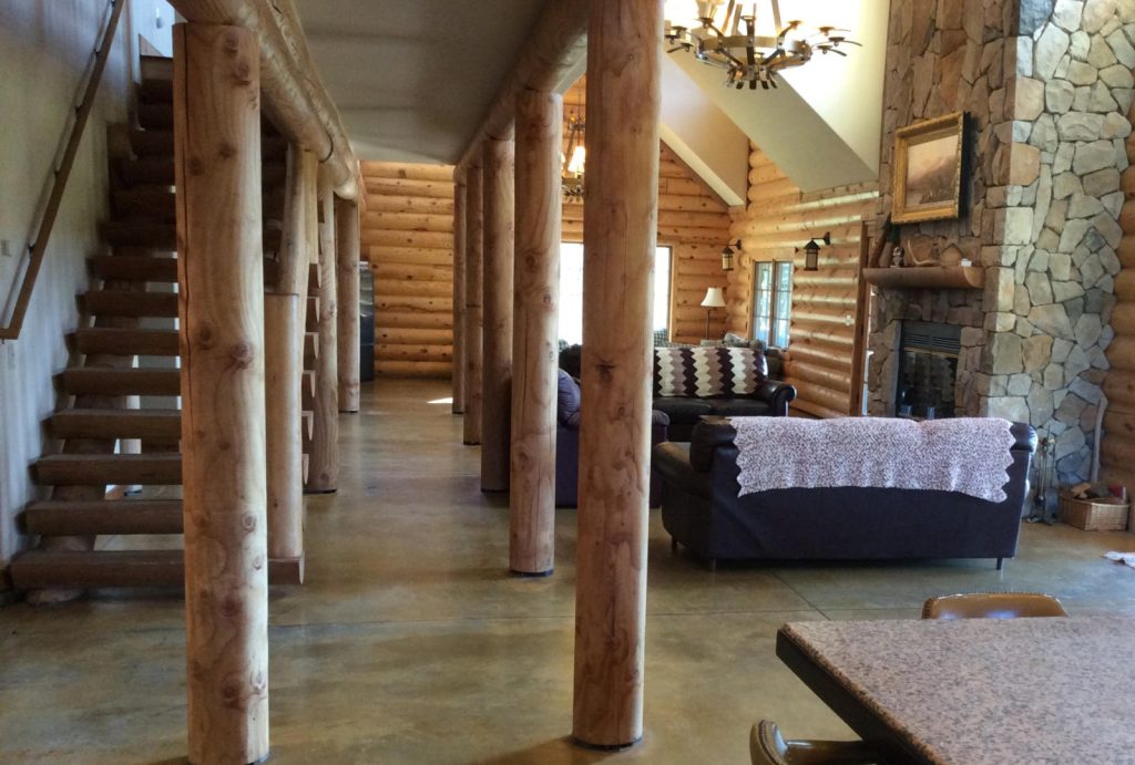 Interior of the Lodge downstairs looking to the living room spaces from the dining table.