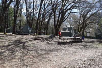 Scouts taking a rest in 12 o'clock next to the fire ring.